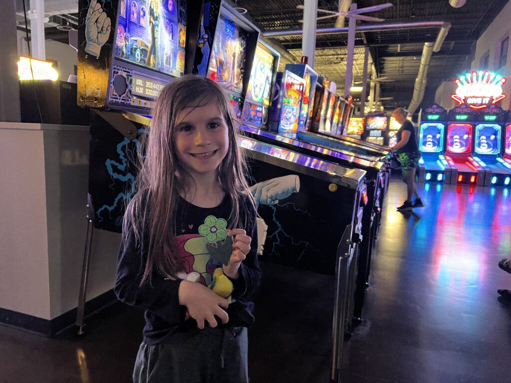A happy player holding a prize