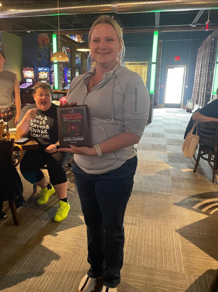 Donelle holding the D&D grand champ plaque