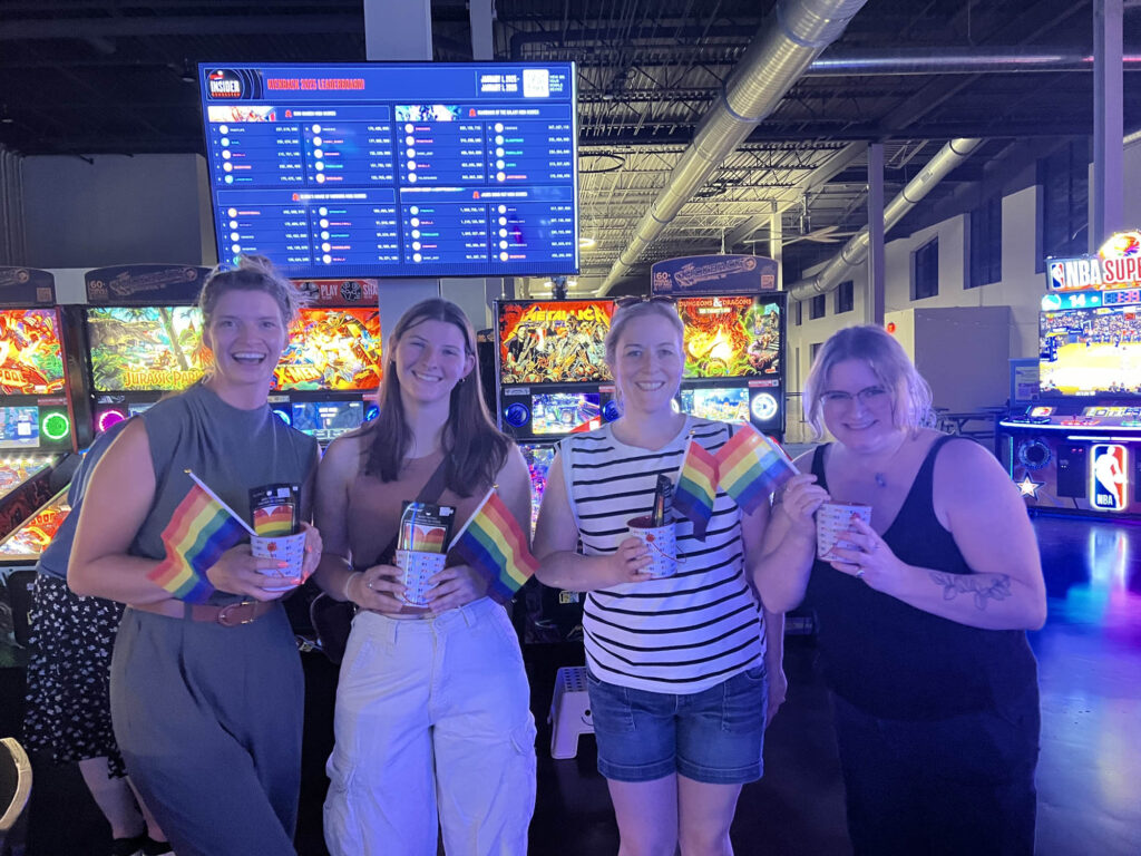 Winners holding prizes from the night