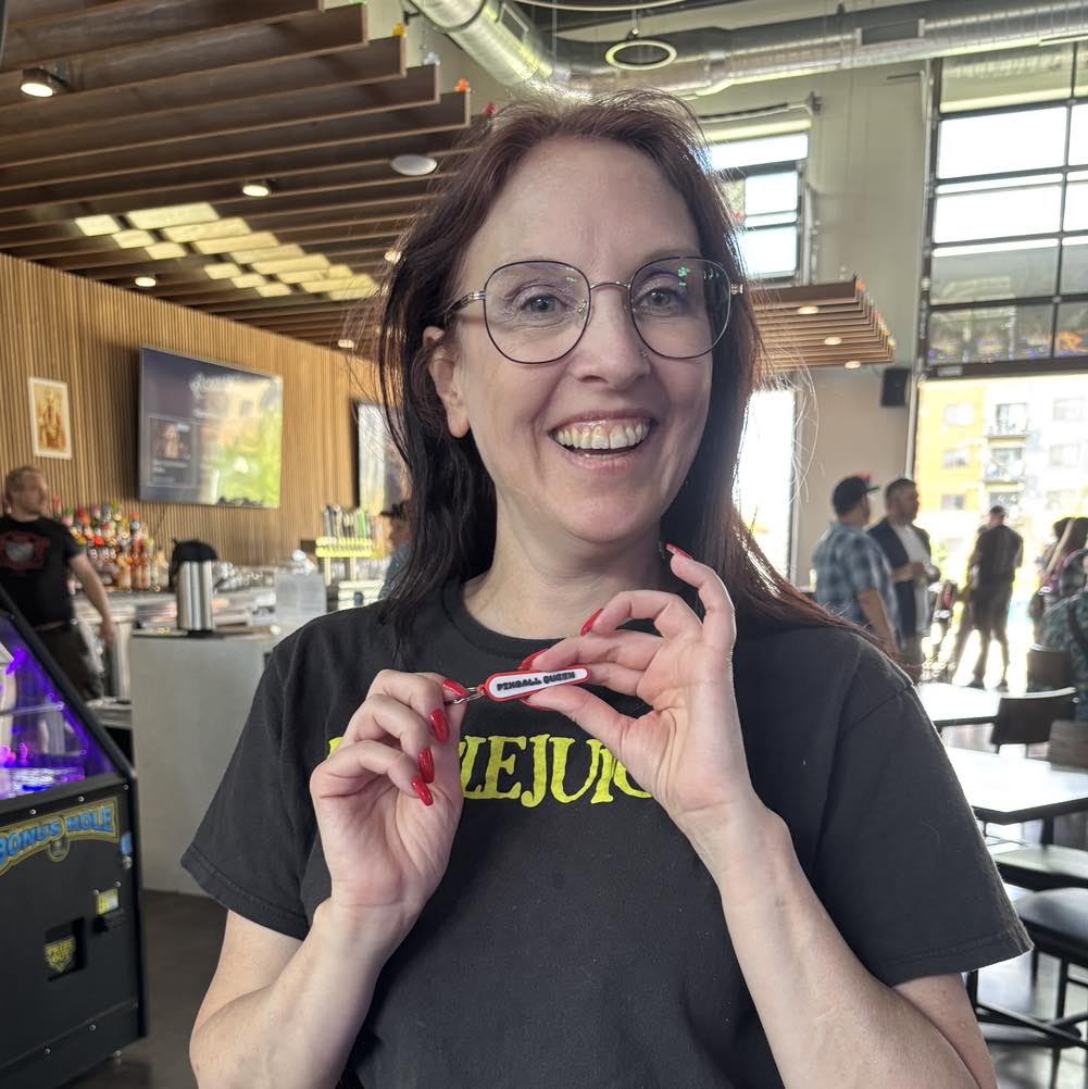 Jessica holding her winnings