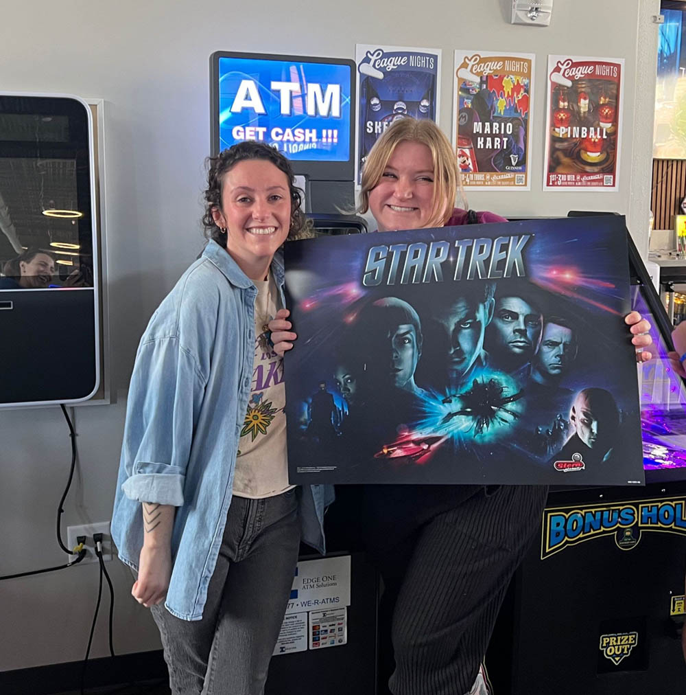 Aimee holding the Star Trek translite she was gifted