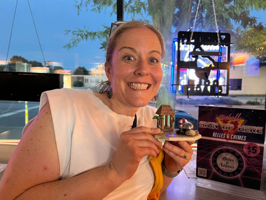 Lauren holding her prize for the night
