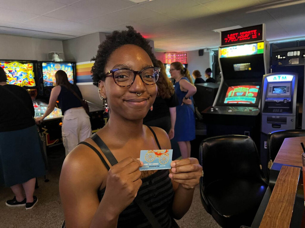 Tumiracle holding her free scope of ice cream ticket