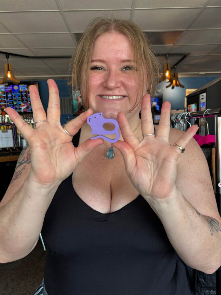 Amiee holding her magnet prize