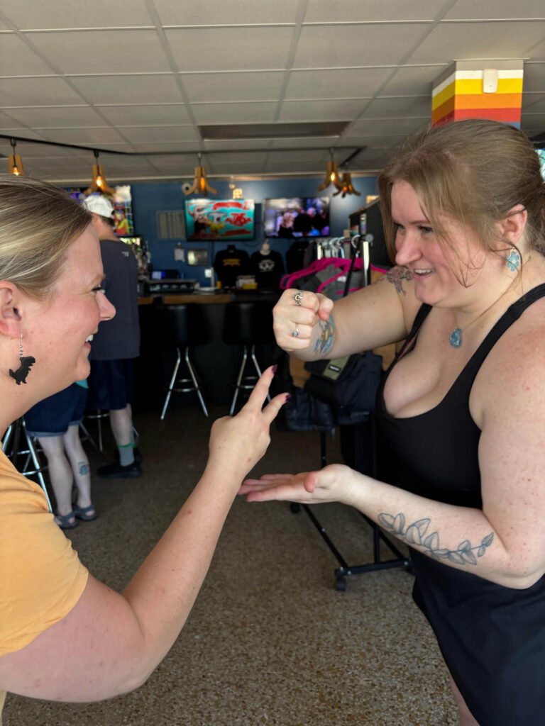 Playing rock paper scissors to see who goes next