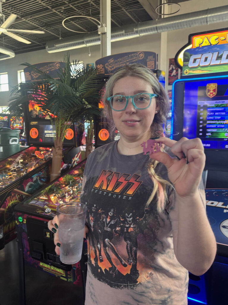 Becky holding a dragon drink marker