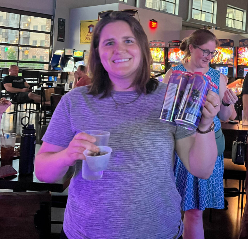 Sam holding their winning beer