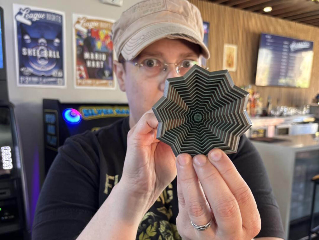 Sharkey holding a fidget toy she won