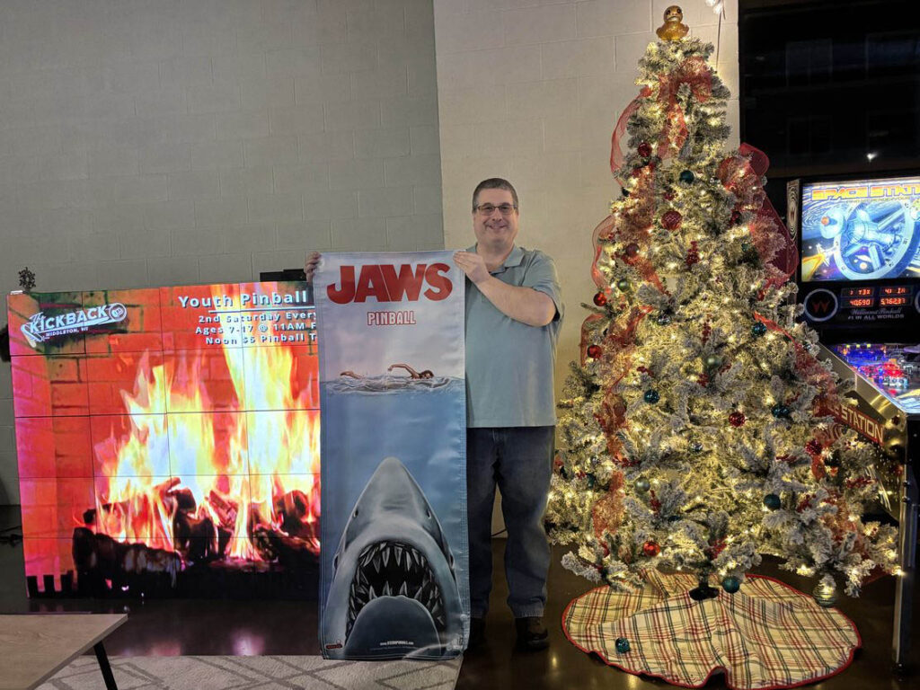 Winner holding their Jaw banner