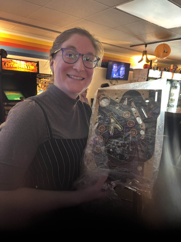 Winner holding a piece of a playfield