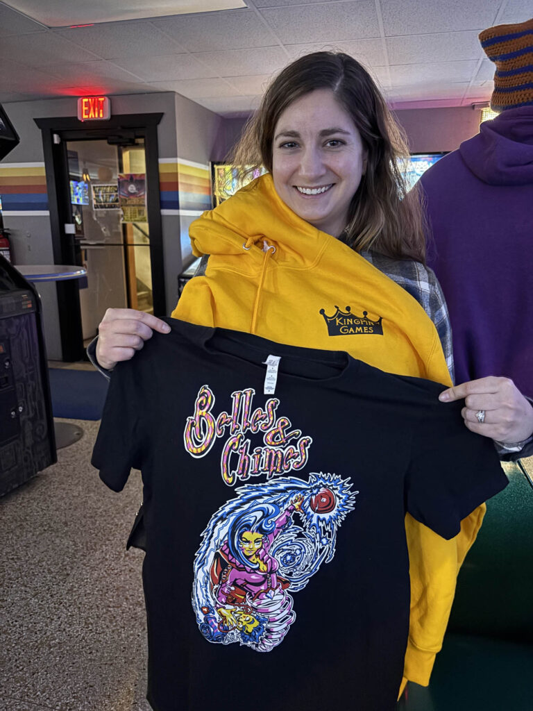 A belle holding shirts she won