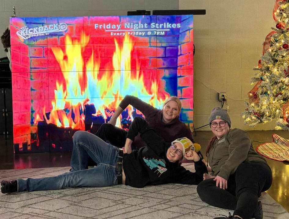 Three belles relaxing in front of the tv fireplace at The Kickback