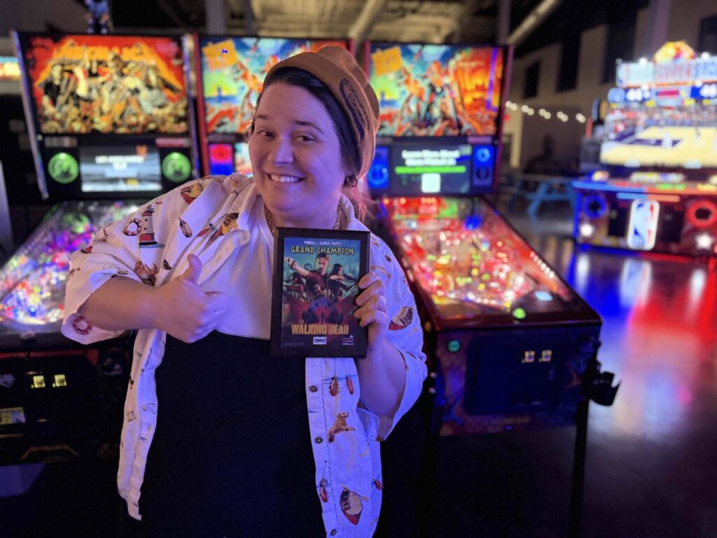 Machenzie holding the Walking Dead grand champ plaque