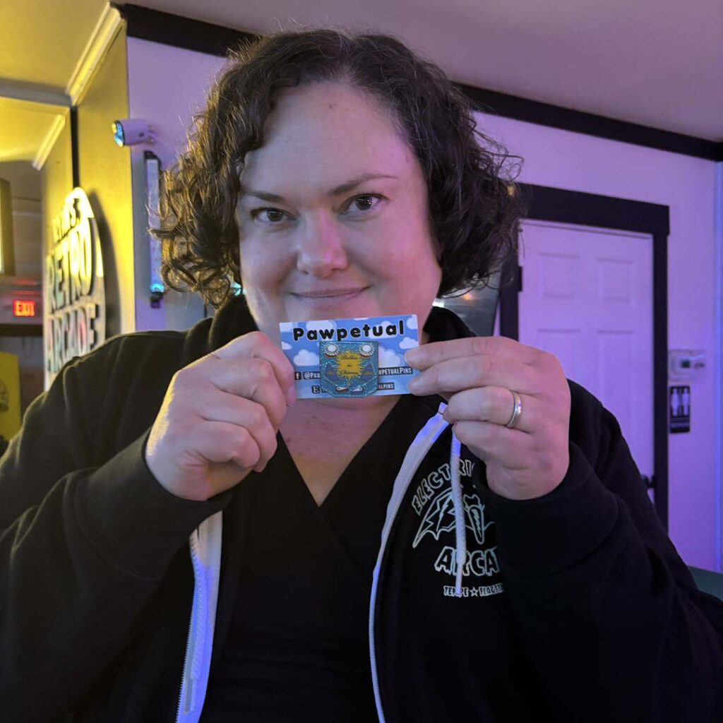 Tamara holding her winning pin