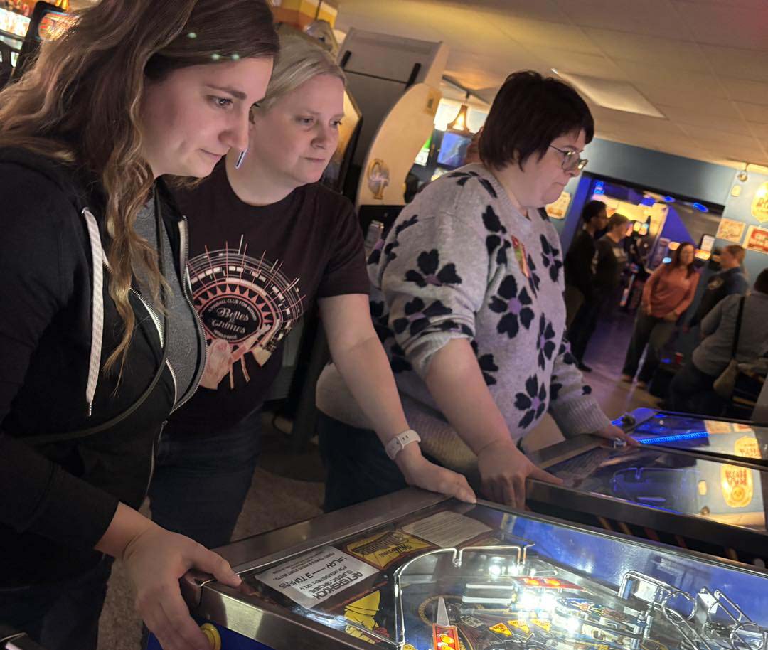 Belles having fun with pinball