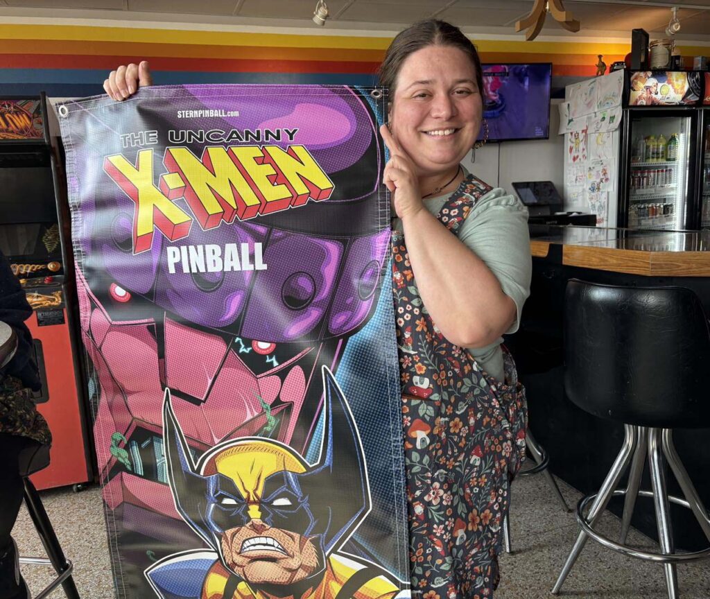 Holding an x-men banner
